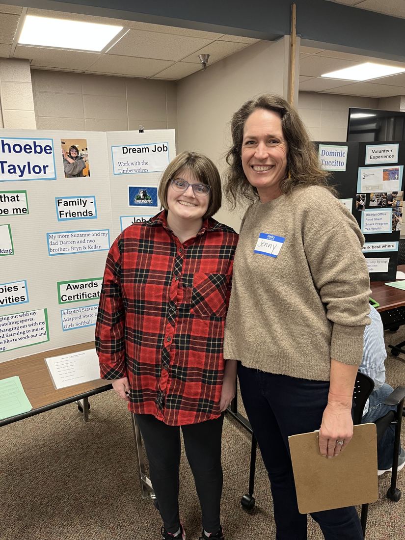 Jenny Peterson with a student at a student showcase